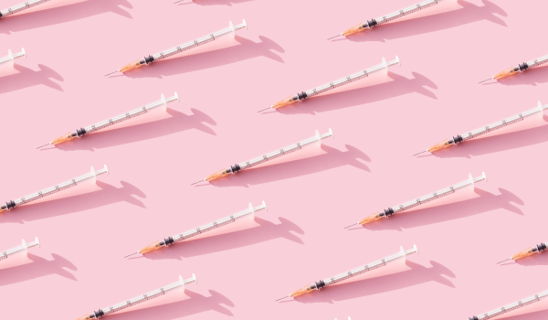 Immunisation needles pink background