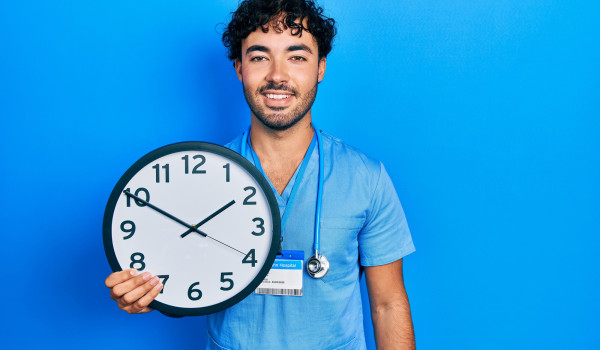 smiling nurse with clock