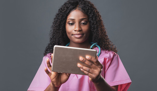 doctor holding up iPad