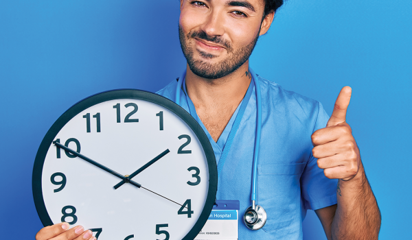 Thumbs up and holding a clock