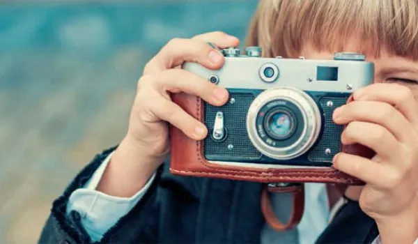 Image of boy taking a photo