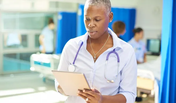 Image of nurse making notes