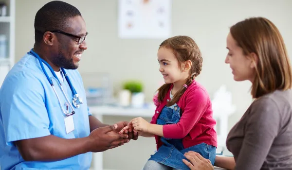 Image of Doctor with mum and daughter