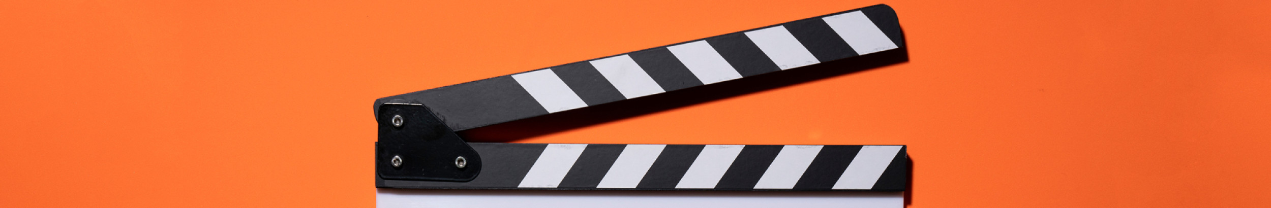 clapperboard on orange