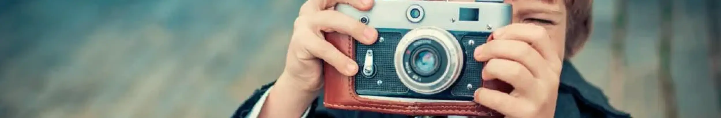 Image of boy taking a photo