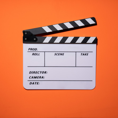 clapperboard on orange