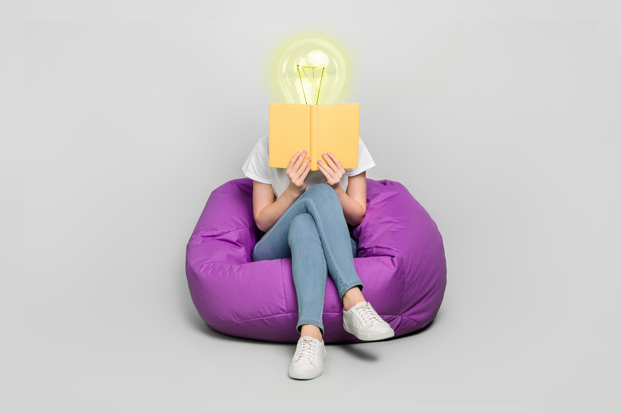 lightbulb person reading a book