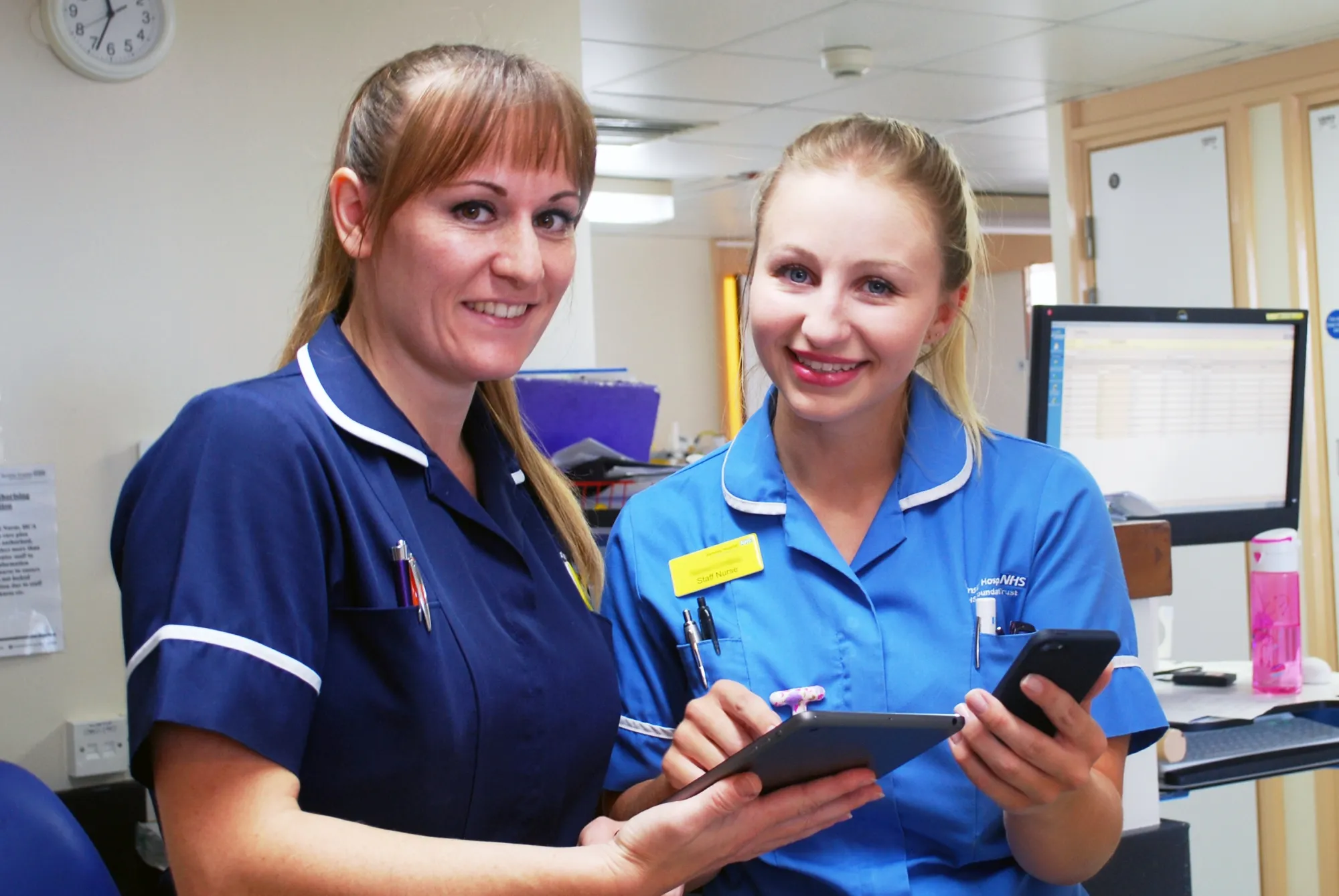 Image of nurses looking at records