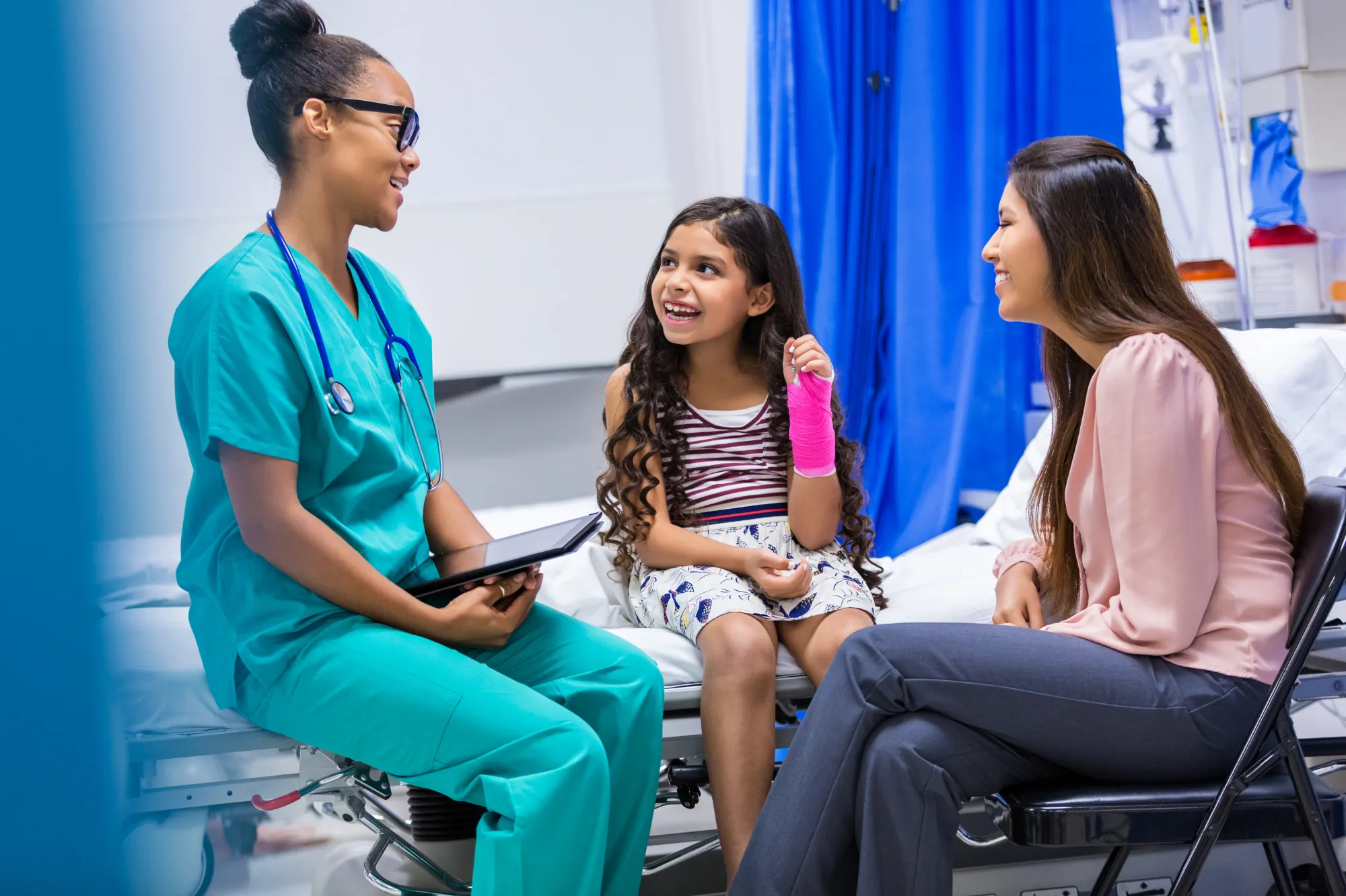 Image of Nurse speaking with mum and child