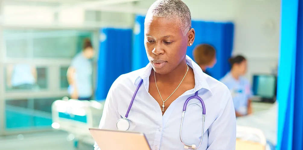 Image of Nurse looking at records